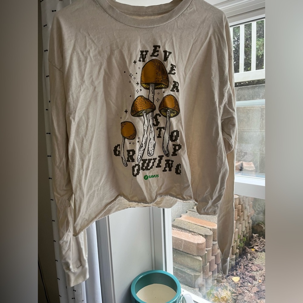 Dravus “Never Stop Growing” Long Sleeve Crop Top
